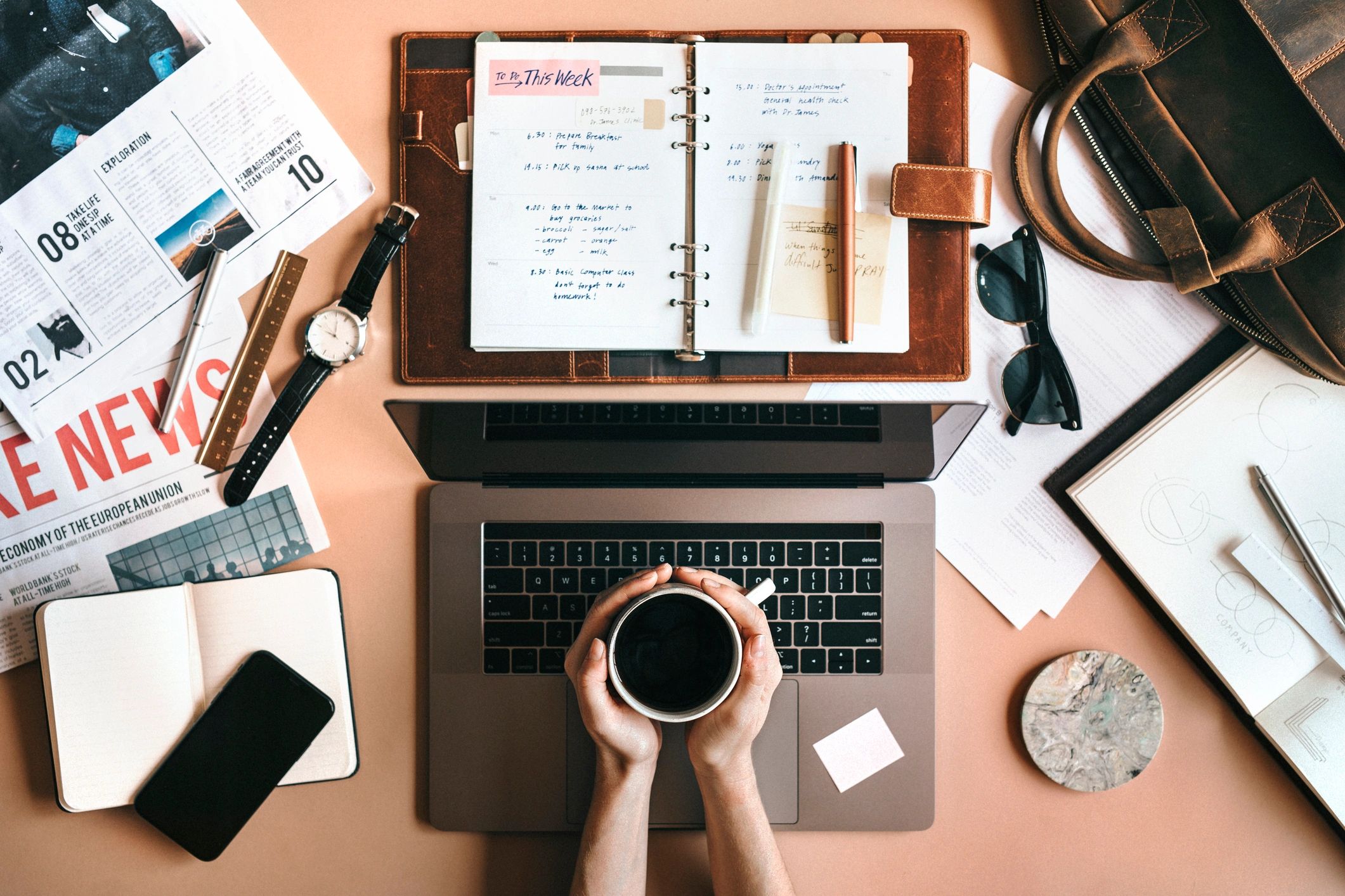 Workspace flat lay with tablet and daily essentials