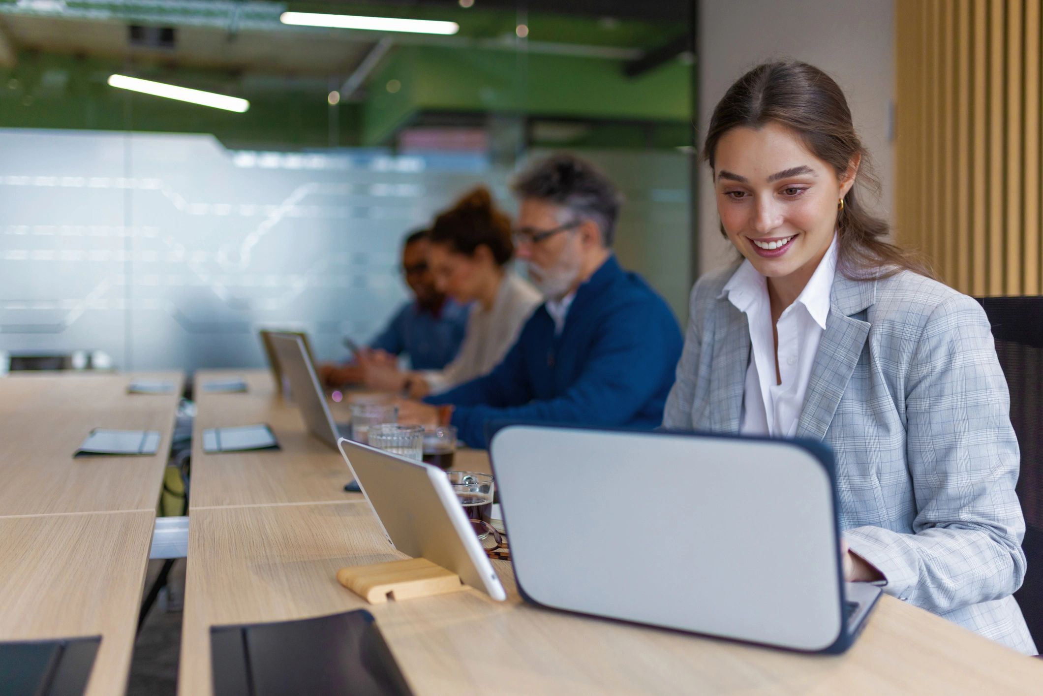 Professional working on a laptop in a modern office