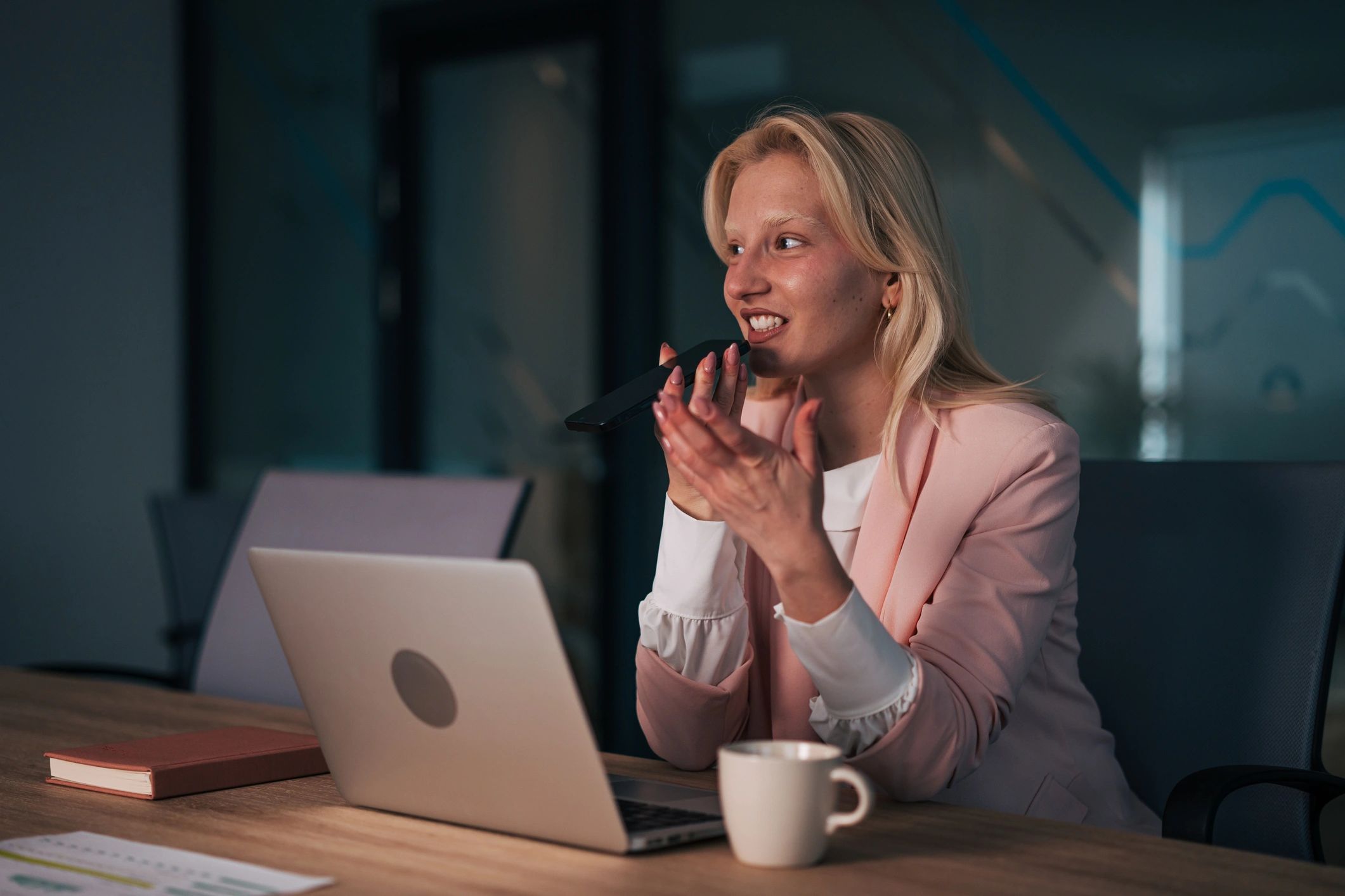 Professional managing calls and messages while working at a desk